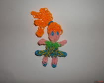Веселая игрушка из разноцветных резиночек "Рыжеволосая девочка"