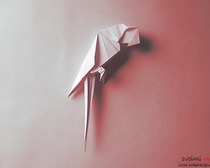 Как сделать птицу попугая с помощью техники оригами?